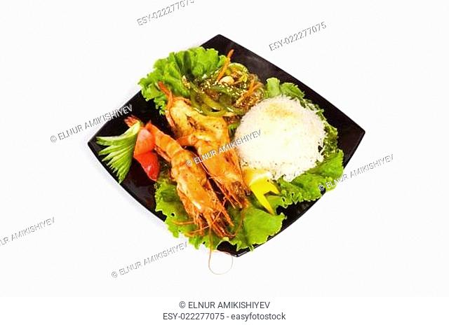 Grilled lobster, rice and vegetables isolated on white