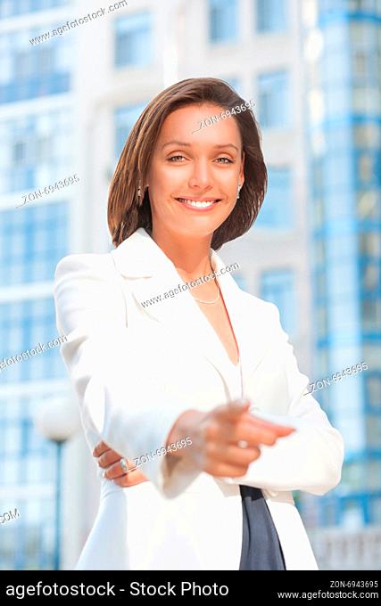 Portrait of beautiful businesswoman with aproval gesture