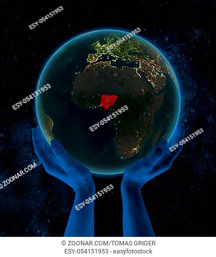 Nigeria on night Earth in hands in space. 3D illustration