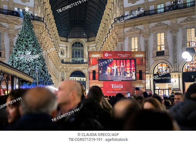 People gather inside the Vittorio Emanuele II gallery to watch the premier of La Scala Theatre on a screen, Milan , ITALY-07-12-2019