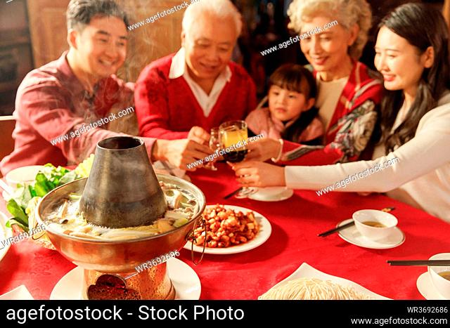 The Oriental family a toast to celebrate the Chinese New Year of happiness