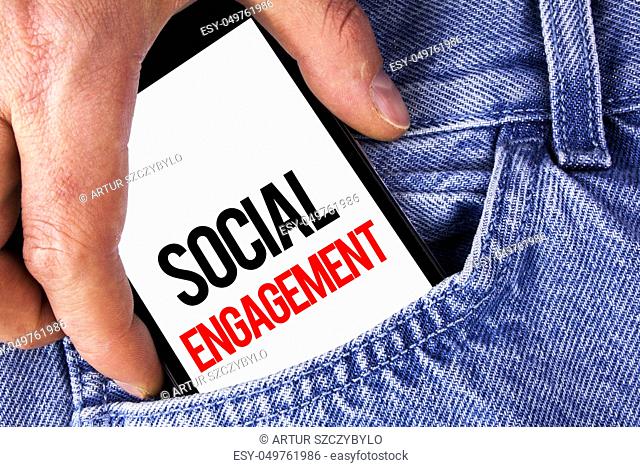 Conceptual hand writing showing Social Engagement. Business photo showcasing post gets high reach Likes Ads SEO Advertising Marketing written Mobile phone...