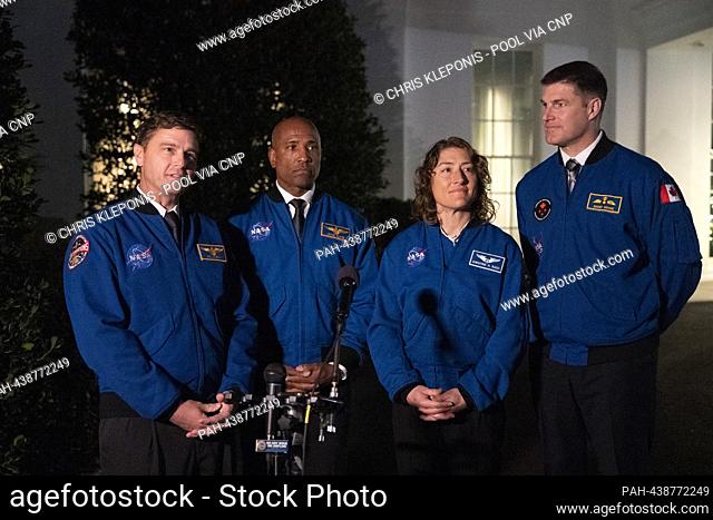 Artemis II crew members Reid Wiseman(L), Victor Glover(2nd L), Christina Hammock Koch(2nd R), and Jeremy Hansen(R) take turns speaking to the media outside the...