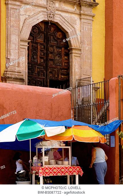 food stand under a colonial church door, Mexico, Guanajuato