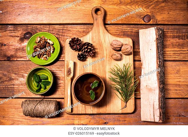 Still life with walnuts on a wooden board on wooden table. concept of eco-friendly items