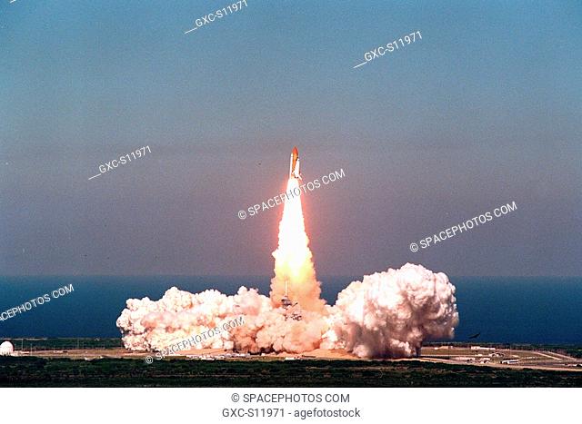 10/29/1998 --- As if sprung from the rolling exhaust clouds below, Space Shuttle Discovery shoots into the heavens over the blue Atlantic Ocean from Launch Pad...
