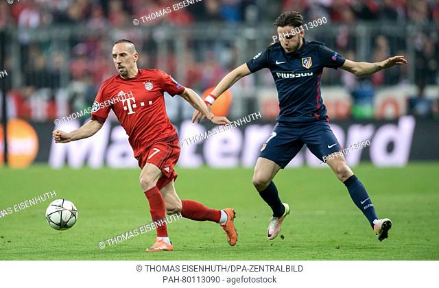 Bayern Munich's Franck Ribery (l) and Madrid's Saul in action during the UEFA Champions League semi final soccer match FC Bayern Munich vs Atletico Madrid in...