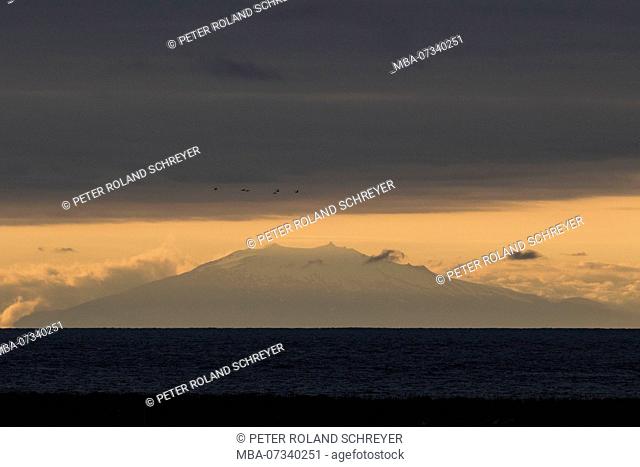 Iceland, volcano Snaefellsjökull, last evening light, distant view over the Faxafloi, stratovolcano, birds, Jules Verne, trip to the center of the earth