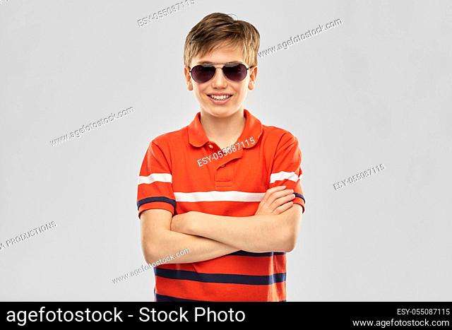 portrait of happy smiling boy in sunglasses