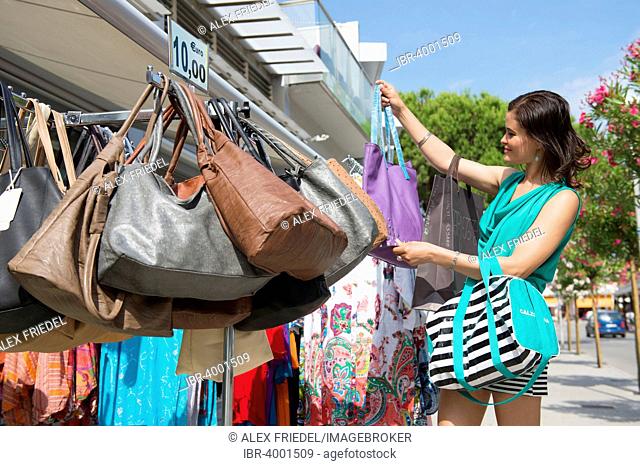 Woman shopping in Bibione, Veneto, Italy