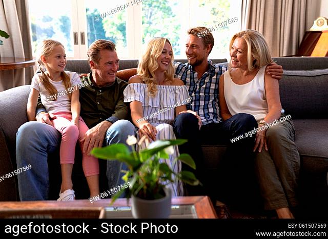 Multi-generation Caucasian family sitting on a couch together