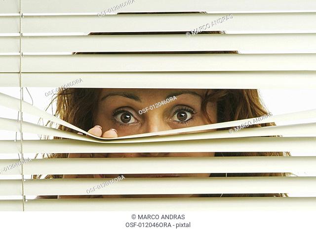 one woman spying by the window