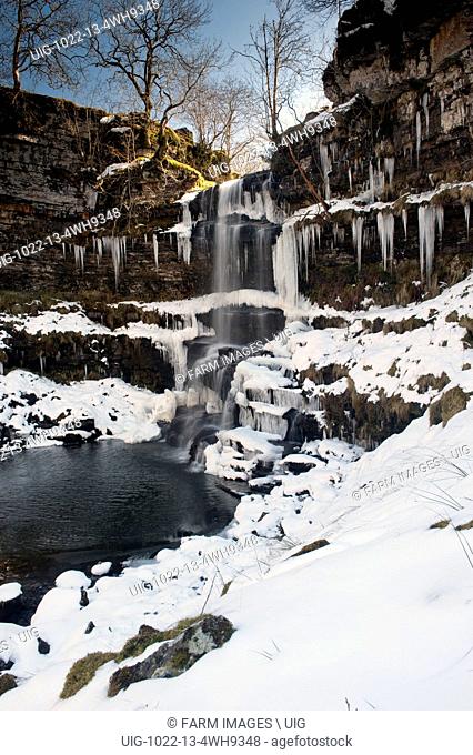 Uldale Falls frozen over in winter. Baugh Fell in the Howgills, Cumbria, UK. (Photo by: Wayne Hutchinson/Farm Images/UIG)