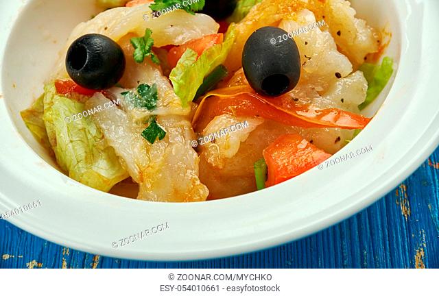 Esqueixada - traditional Catalan dish, a salad of shredded salt cod, tomatoes, onions, olive oil and vinegar, salt