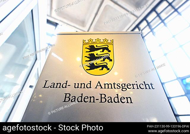 30 November 2023, Baden-Württemberg, Baden-Baden: A sign with the inscription ""Land- und Amtsgericht Baden-Baden, taken at the court
