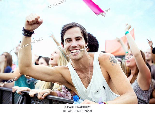 Enthusiastic man cheering at music festival