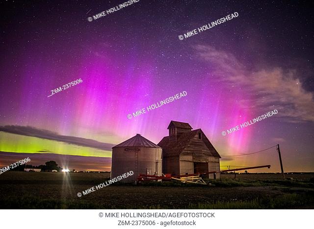 Nothern lights dance above the Iowa landscape
