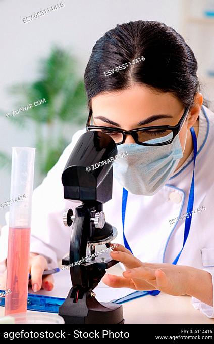 Young female chemist working in the lab