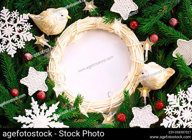 Christmas background with wreath decor and fir tree branches and white background copy space for text border frame for text