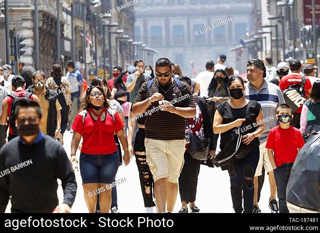 MEXICO CITY, MEXICO - JULY 15: Crowd of people in the Mexico City downtown, after the government lowered safety measures by Covid-19 are registered 12