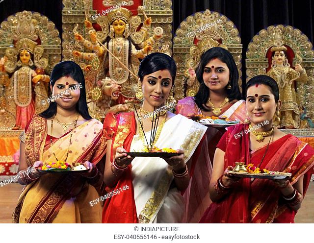 Bengali women celebrating Durga puja