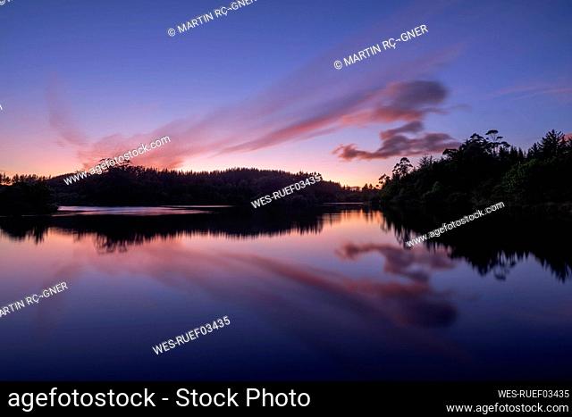 Long exposure of Lake Mangamahoe at purple dawn