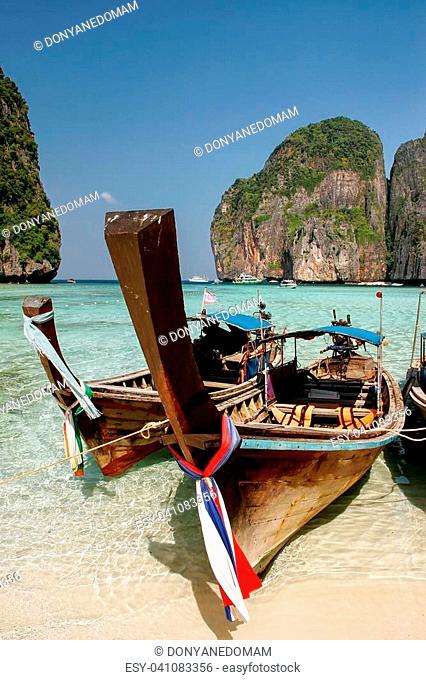 Longtail boats anchored at Maya Bay on Phi Phi Leh Island, Krabi Province, Thailand. It is part of Mu Ko Phi Phi National Park