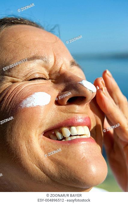 Woman Skin cancer protection suncream