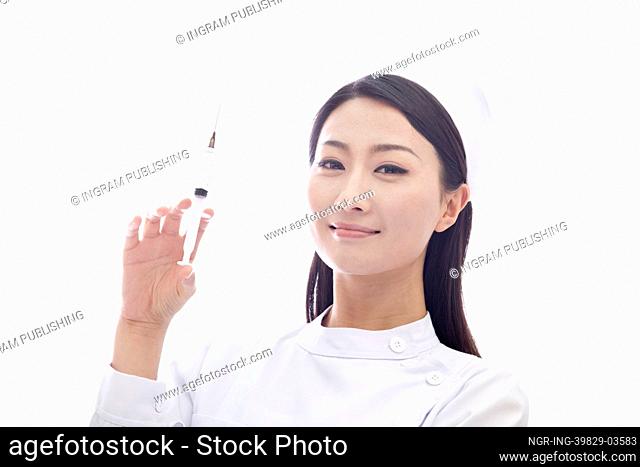 Portrait of Nurse Holding a Syringe