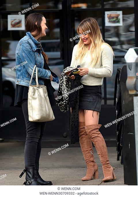 Hilary Duff struts her stuff in a denim skirt and knee high boots while out for lunch with a friend at Joan's on Third in Studio City Featuring: Hilary Duff...