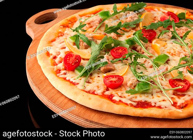 one pizza on a wooden tray