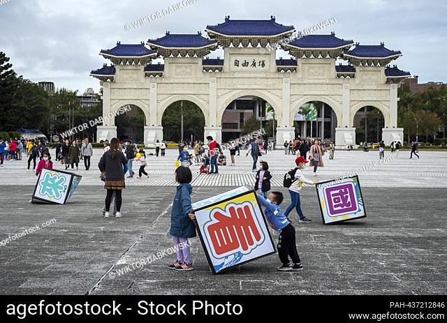 Children play with giant blocks bearing Chinese characters in Liberty Square, Taipei, Taiwan, on 03/12/2023 during the Reading Festival