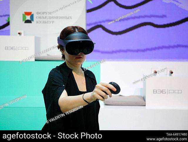 RUSSIA, ST PETERSBURG - NOVEMBER 17, 2023: A participant uses a VR headset at the 2023 St Petersburg International Cultural Forum - Forum of United Cultures at...