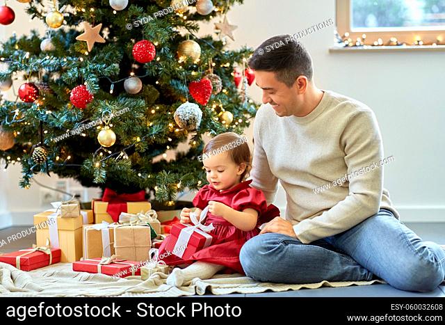 happy father and baby daughter on christmas