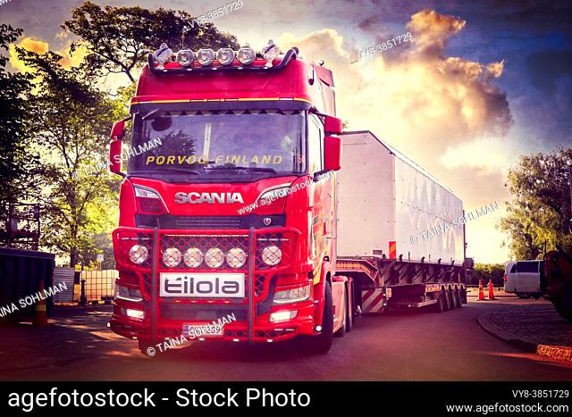 Red Next Generation Scania truck in front semi trailer of Eilola Logistics Oy, special transport. Helsinki, Finland. July 27, 2021. - Filtered image