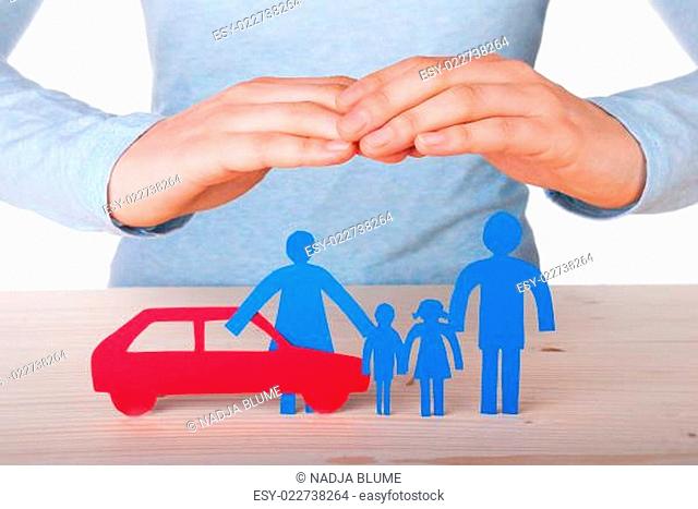 Hands Guarding Family and Car