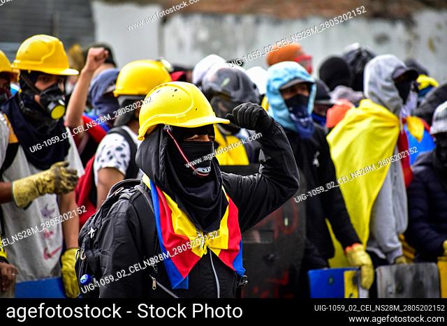 Members of the front line of defense pose and stand in guard during protests as Colombia marks its firts month of anti-government protests against President...