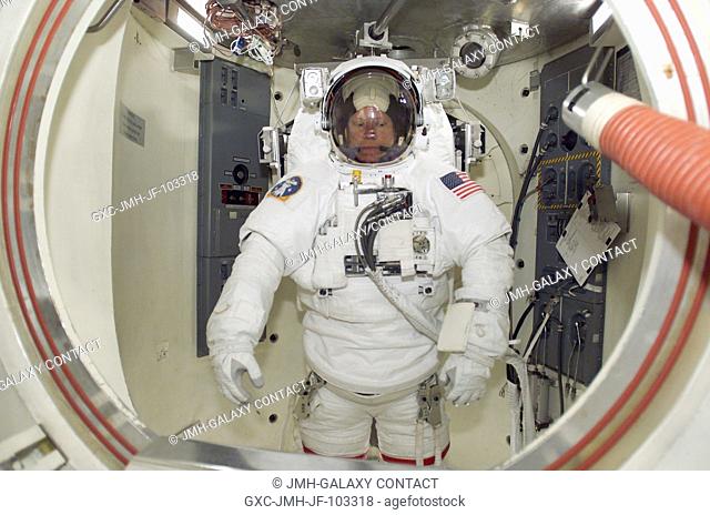 Astronaut David M. Brown, STS-107 mission specialist, wearing a training version of the Extravehicular Mobility Unit (EMU) space suit