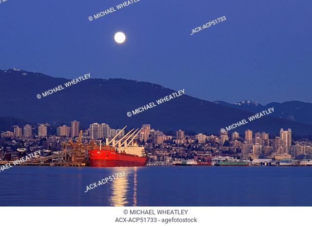 Ship and moonrise, North Vancouver, British Columbia, Canada