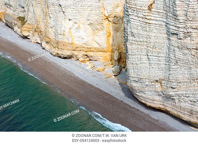 Colorful vertical limestone cliffs with beach near Etretat in Normandy, France