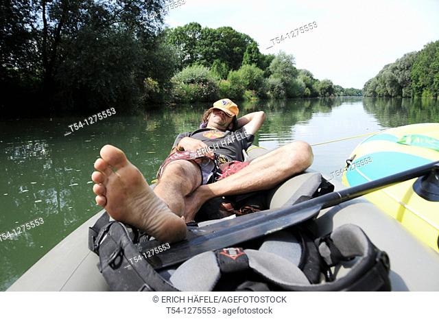 Man taking a nap on a boat