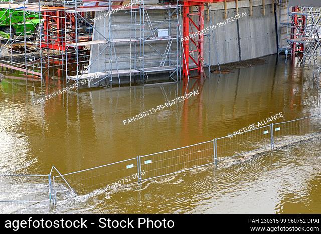 15 March 2023, Saxony-Anhalt, Magdeburg: A flooded construction road at the construction site of the new bridge in Magdeburg