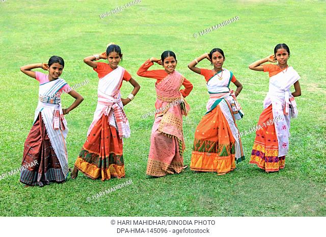 Assamese girls performing dance and celebrating Bihu festival (new year celebration) Assam ; India NO MR