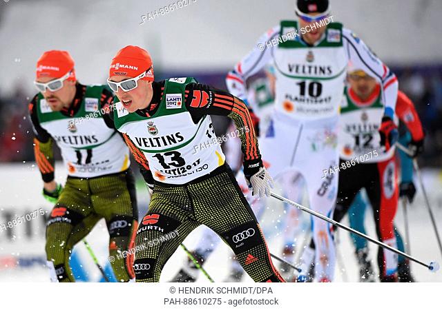 Fabian Riessle and Eric Frenzel from Germany and Magnus Moan from Norway (f.l.) in action on the course at the Nordic Ski World Championship in Lahti, Finland