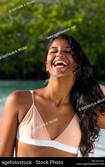 portrait young brunette woman natural laughing. happiness concept