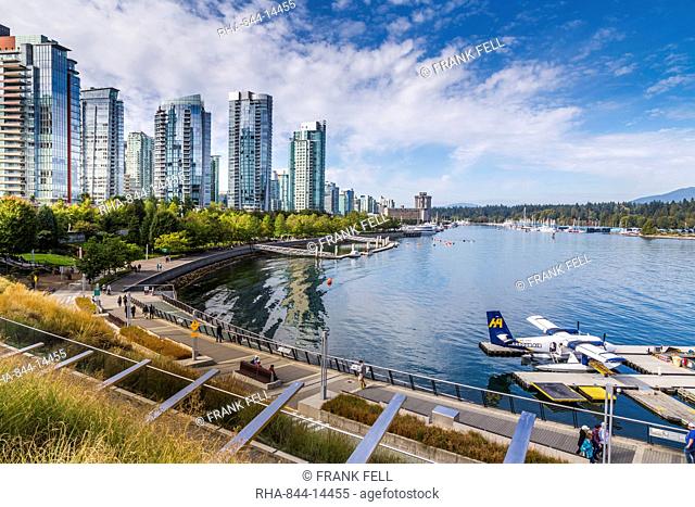 View of seaplane and urban office buildings around Vancouver Harbour, Downtown, Vancouver, British Columbia, Canada, North America