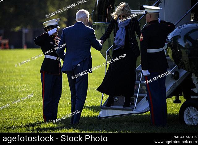 United States President Joe Biden helps first lady Dr. Jill Biden down the stairs of Marine One at Fort Leslie McNair on October 23, 2023 in Washington, D