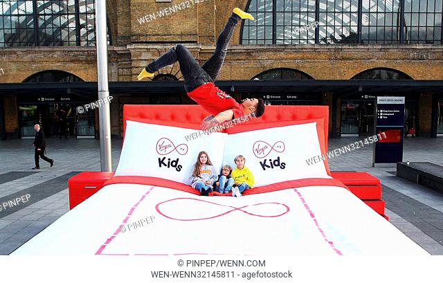 FREE FOR EDITORIAL USE Morning commuters were treated to a surprise today in London, seeing kids of all ages jumped for joy on Virgin TV”s giant 15 square metre...
