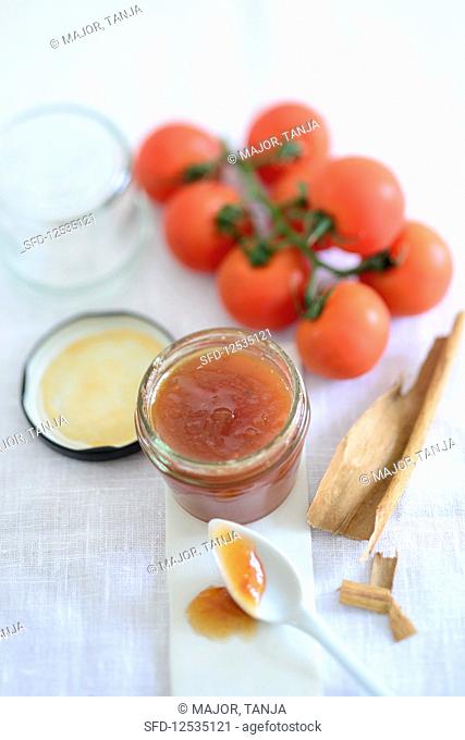 Red tomato chutney with brown rock sugar and cinnamon