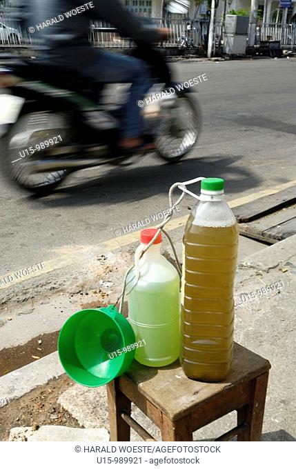 Small volumes of petrol for the many small motorbikes are sold almost everywhere, Nha Trang, Vietnam